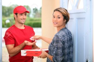 13841731-Man-delivering-pizza-Stock-Photo